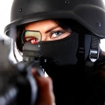 Northern Ireland fine art photographer - woman wearing face mask and military style helmet looking through military rifle sight